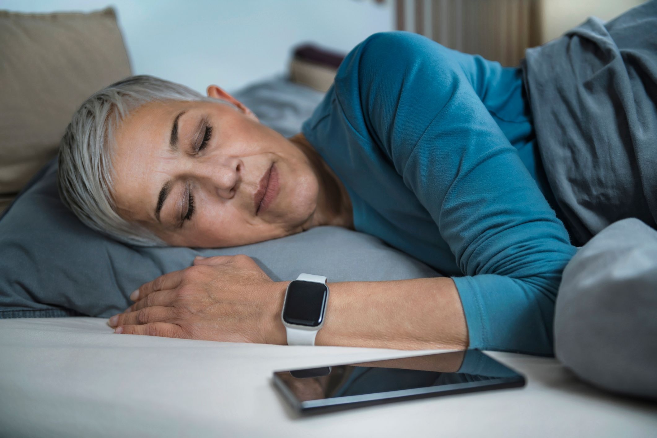 Woman wearing Apple Watch while sleeping