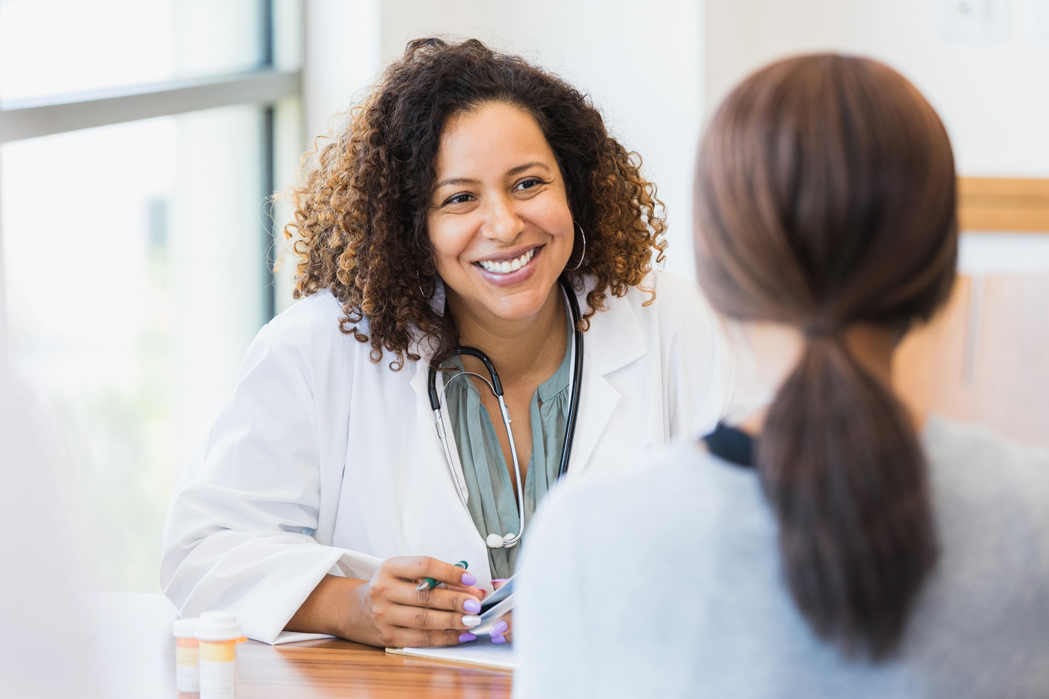 Doctor discusses healthcare options with her patient